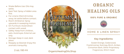 Label for Autumn Alchemy Home & Linen Spray by Organic Healing Oils. The label features a birch forest with autumn leaves in the background and instructions for use on the left. The product is described as 100% pure and organic, highlighting key ingredients like sweet orange, cedarwood, frankincense, nutmeg, birch, amber, cinnamon bark, other proprietary fragrances, and witch hazel. The label also includes safety and storage instructions and the website OrganicHealingOils.Shop.