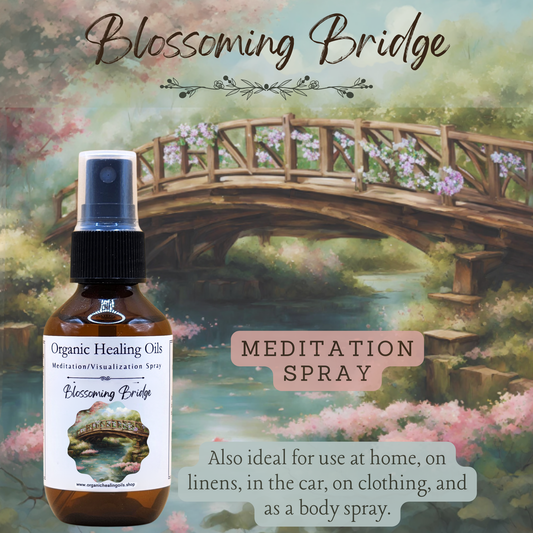 A tranquil scene with cherry blossoms and a wooden bridge over a calm river, featuring a bottle of 'Blossoming Bridge' meditation spray from Organic Healing Oils