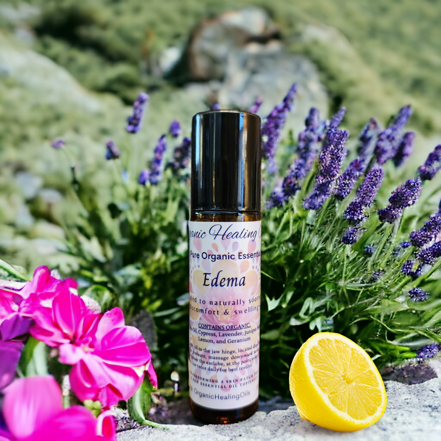 Natural Edema Soothing Oil roller from Organic Healing Oils set against a backdrop of lush greenery and a bright lemon slice, symbolizing freshness and purity.