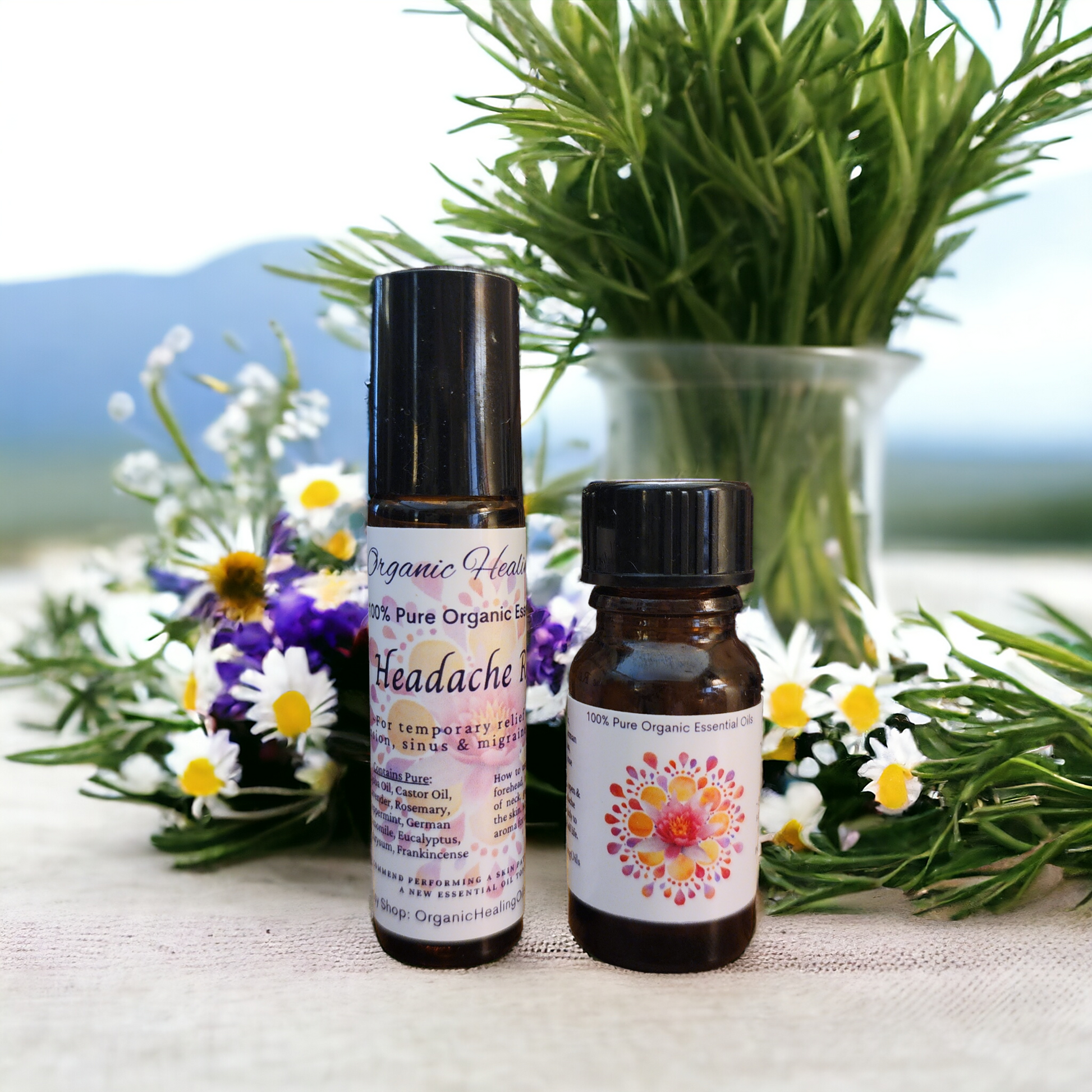 Headache Soothing essential oil roller and sniffer salt by Organic Healing Oils placed among fresh lavender and daisies, portraying natural ingredients for soothing relief.