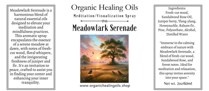 Label featuring A serene meadow at sunrise with a majestic tree and meadowlarks in the foreground, accompanied by a bottle of 'Meadowlark Serenade' meditation spray from Organic Healing Oils.