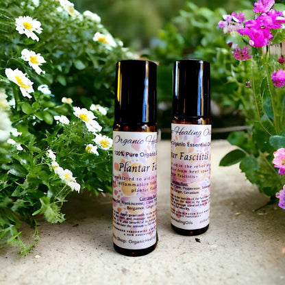 Organic Healing Oils' rollers for Plantar Fasciitis nestled among blooming flowers, showcasing natural solutions for foot wellness.