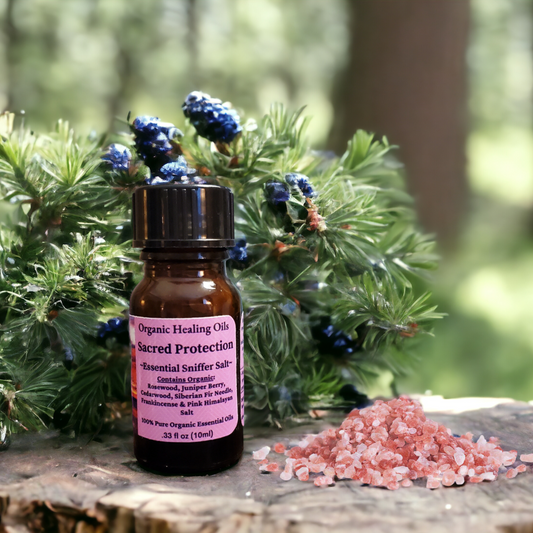 Sacred Protection sniffer salts placed amidst lush greenery, signifying its grounding and protective nature, with Himalayan pink salt crystals nearby.