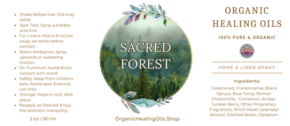 Label for Sacred Forest Home & Linen Spray by Organic Healing Oils. The label features a misty forest scene with lush greenery. Instructions for use are on the left. The product is described as 100% pure and organic, highlighting key ingredients like cedarwood, frankincense, black spruce, cinnamon bark, blue tansy, other proprietary fragrances.