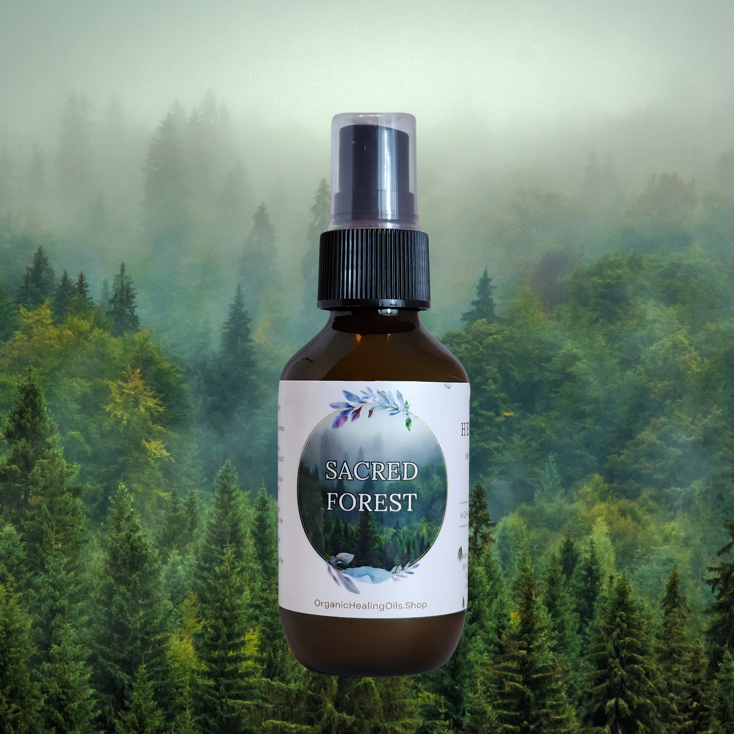 Sacred Forest spray bottle by Organic Healing Oils, in front of a misty forest backdrop with lush green trees. The scene evokes the tranquility and freshness of a forest sanctuary, highlighting the natural and grounding essence of the spray.