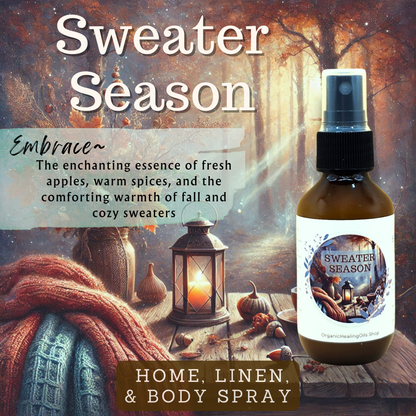 Sweater Season Essential Oil Spray Bottle on a wooden table surrounded by autumn decorations, including a lantern, fall leaves, and a cozy sweater, creating a warm and inviting atmosphere.